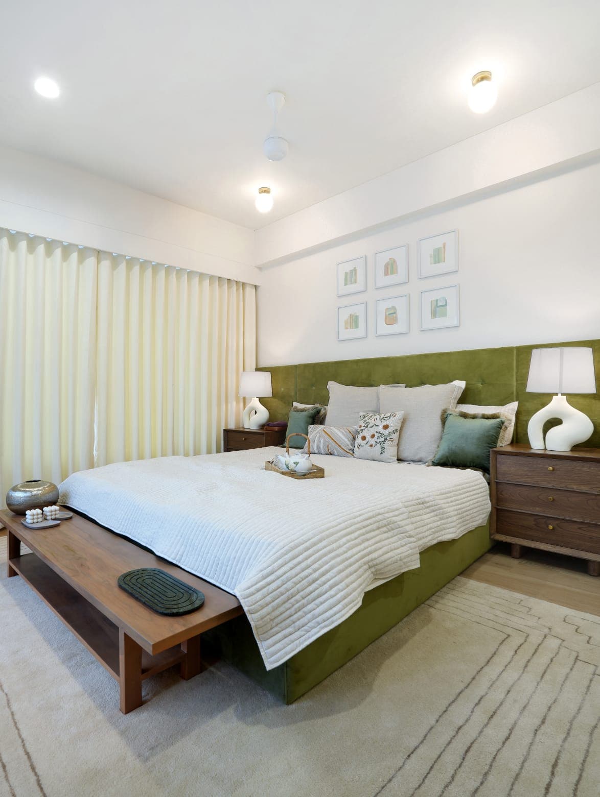 Green velvet king bed with walnut side tables