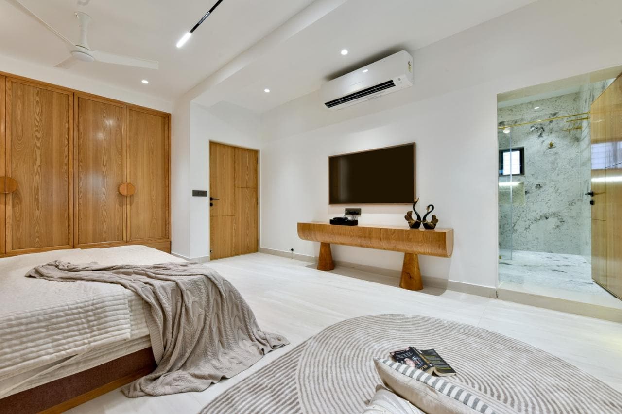 Bedroom with teak wardrobe wall and console TV unit