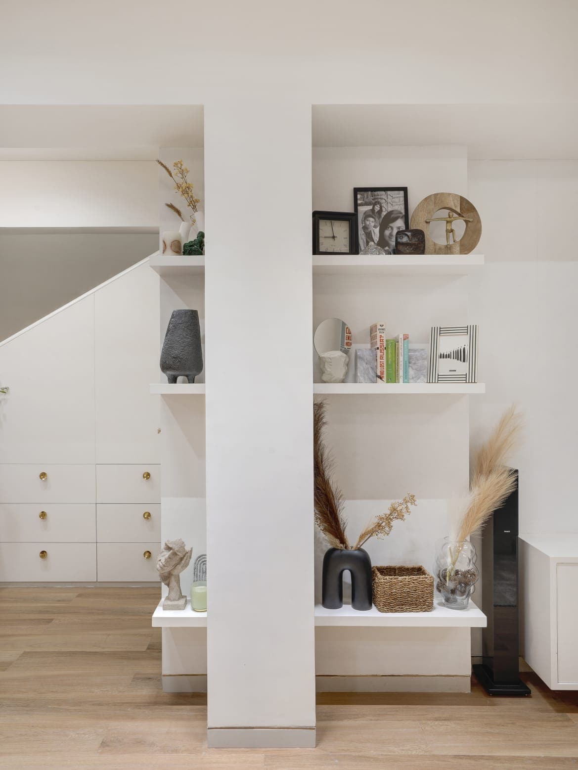 White under-stair shelving with display niches