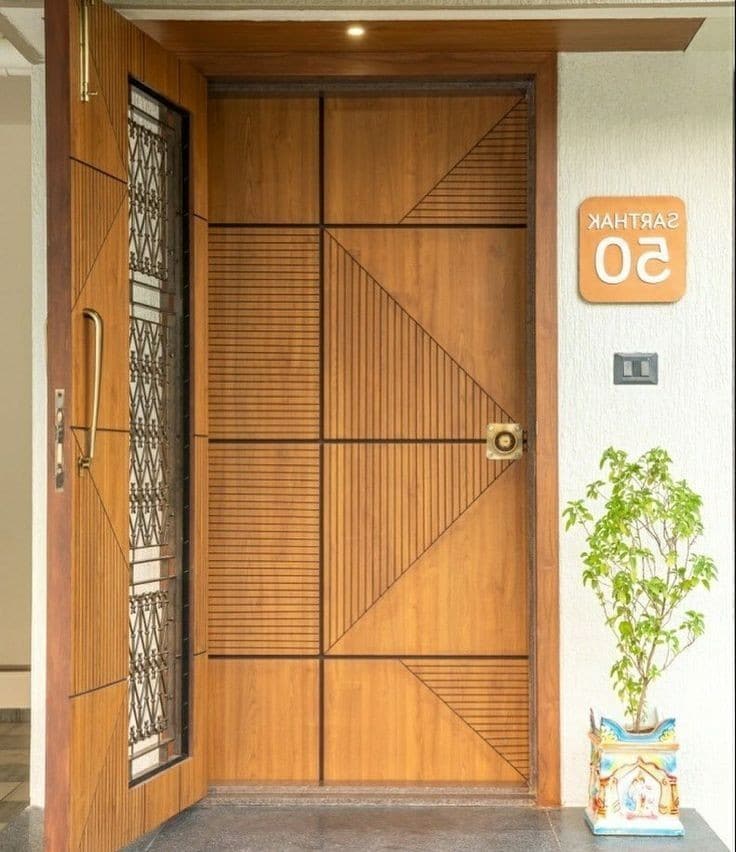 Diagonal-panel main door with brass house nameplate