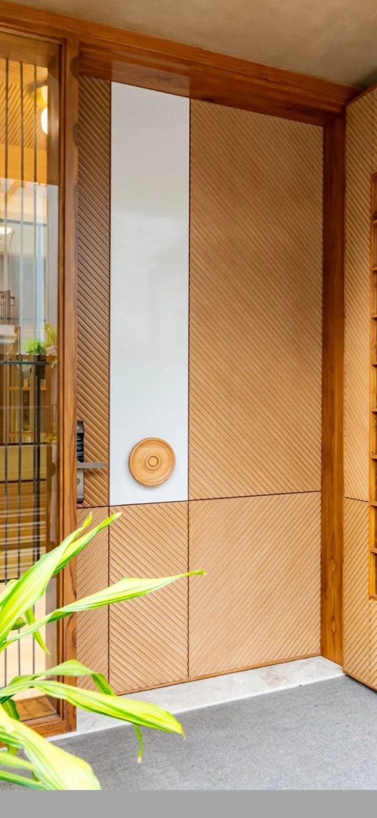 Marble and wood entrance with turned-wood medallion