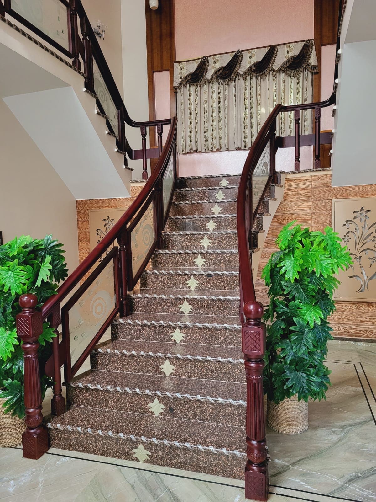 Traditional staircase with carved wooden railing
