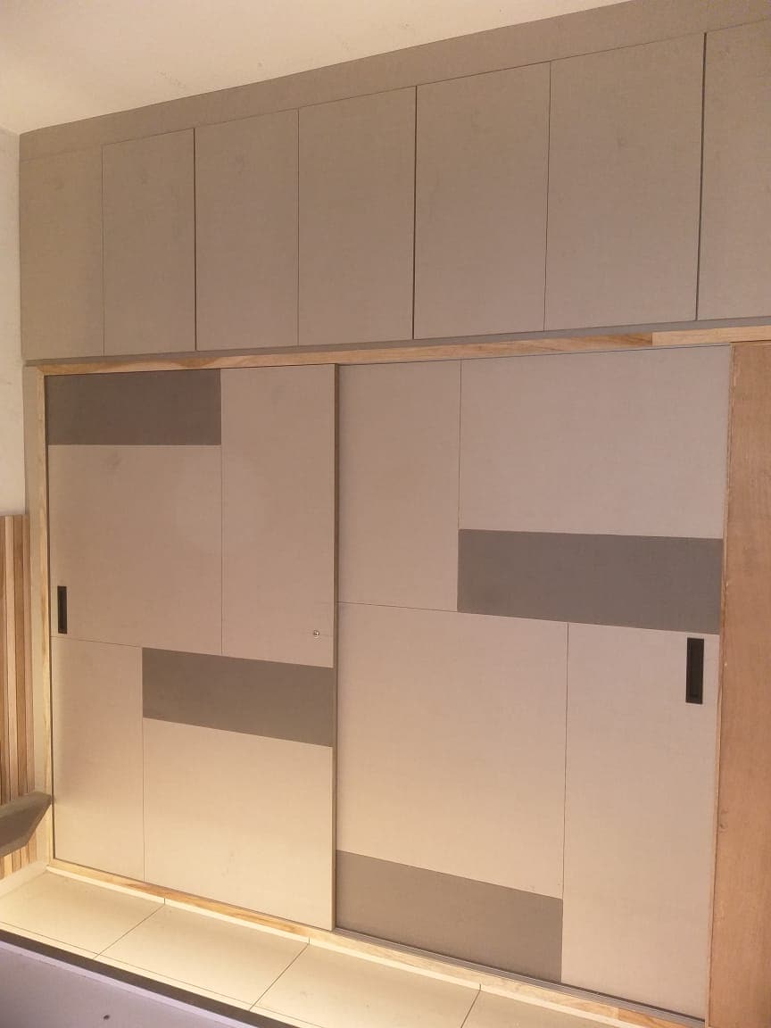 Cream sliding wardrobe with grey accent panels