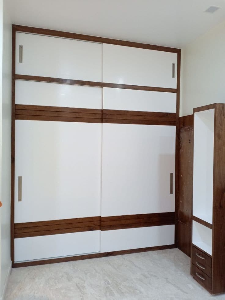 White sliding wardrobe panels in solid teak frame